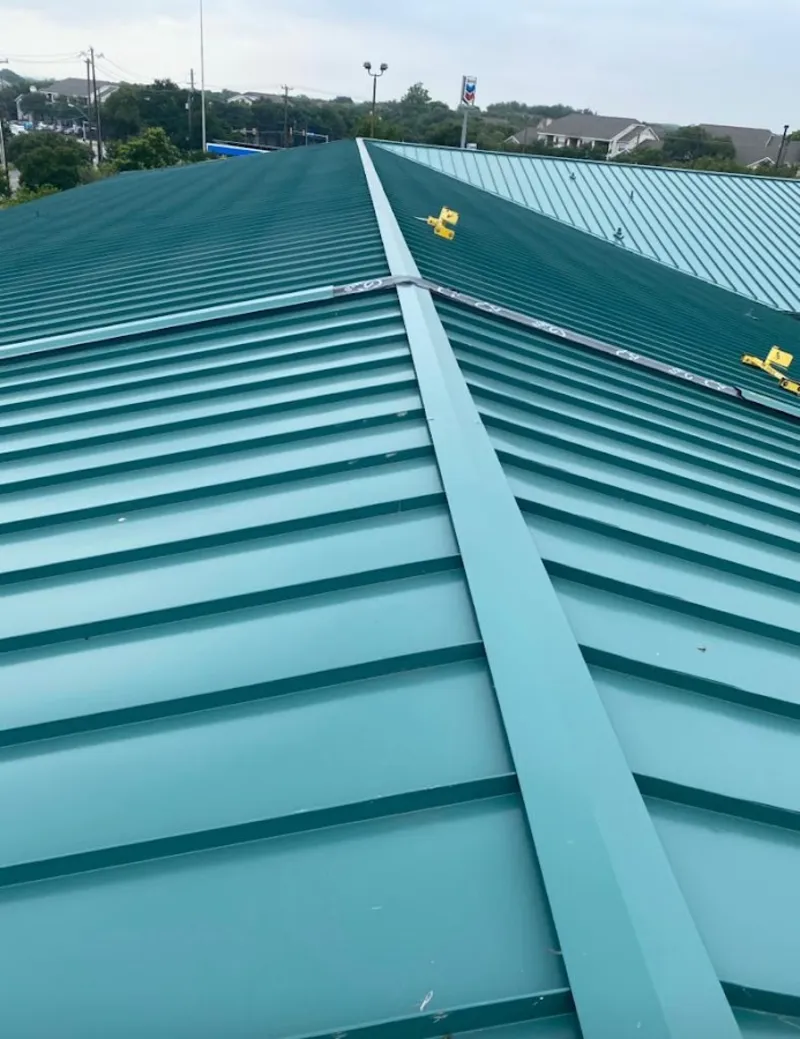 Green commercial metal roof ridge and valley for Metal Roof Repair in Dove Valley